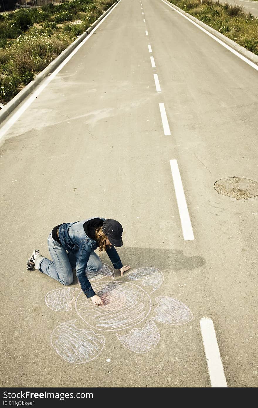 Young artist painting on the street. Young artist painting on the street