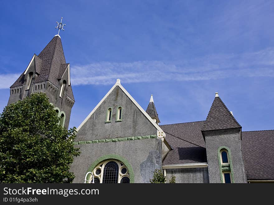 Old Gray Stucco House and Vapor Trail