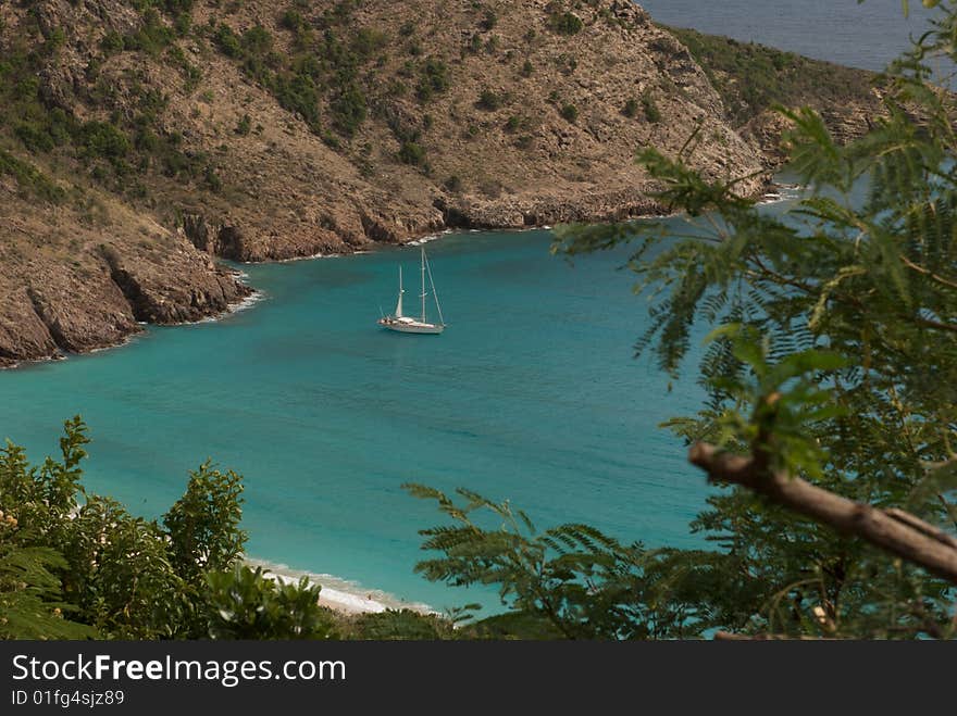 Tropical Bay with Sailboat