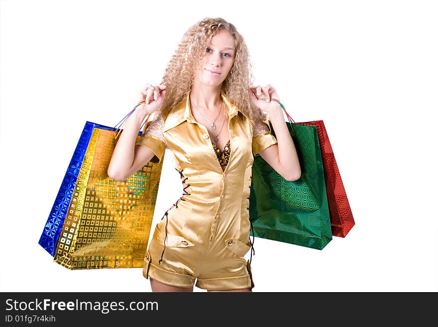 The young beautiful girl with purchases in colour packages during shopping on a white background