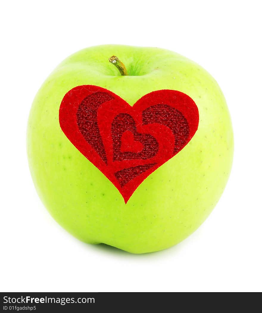 Green apple and red heart made of cloth