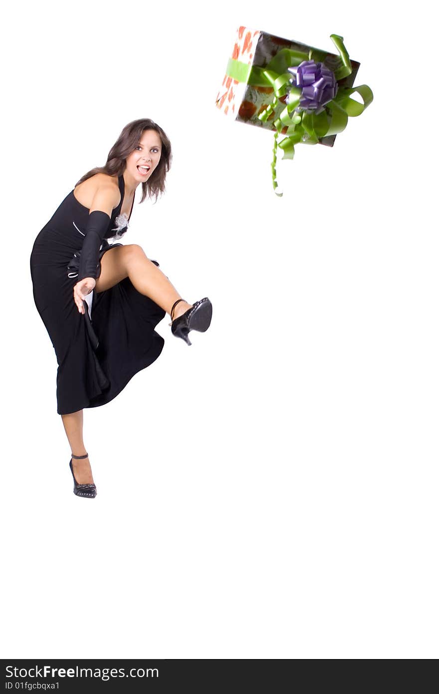 The young beautiful girl with a gift box on a white background