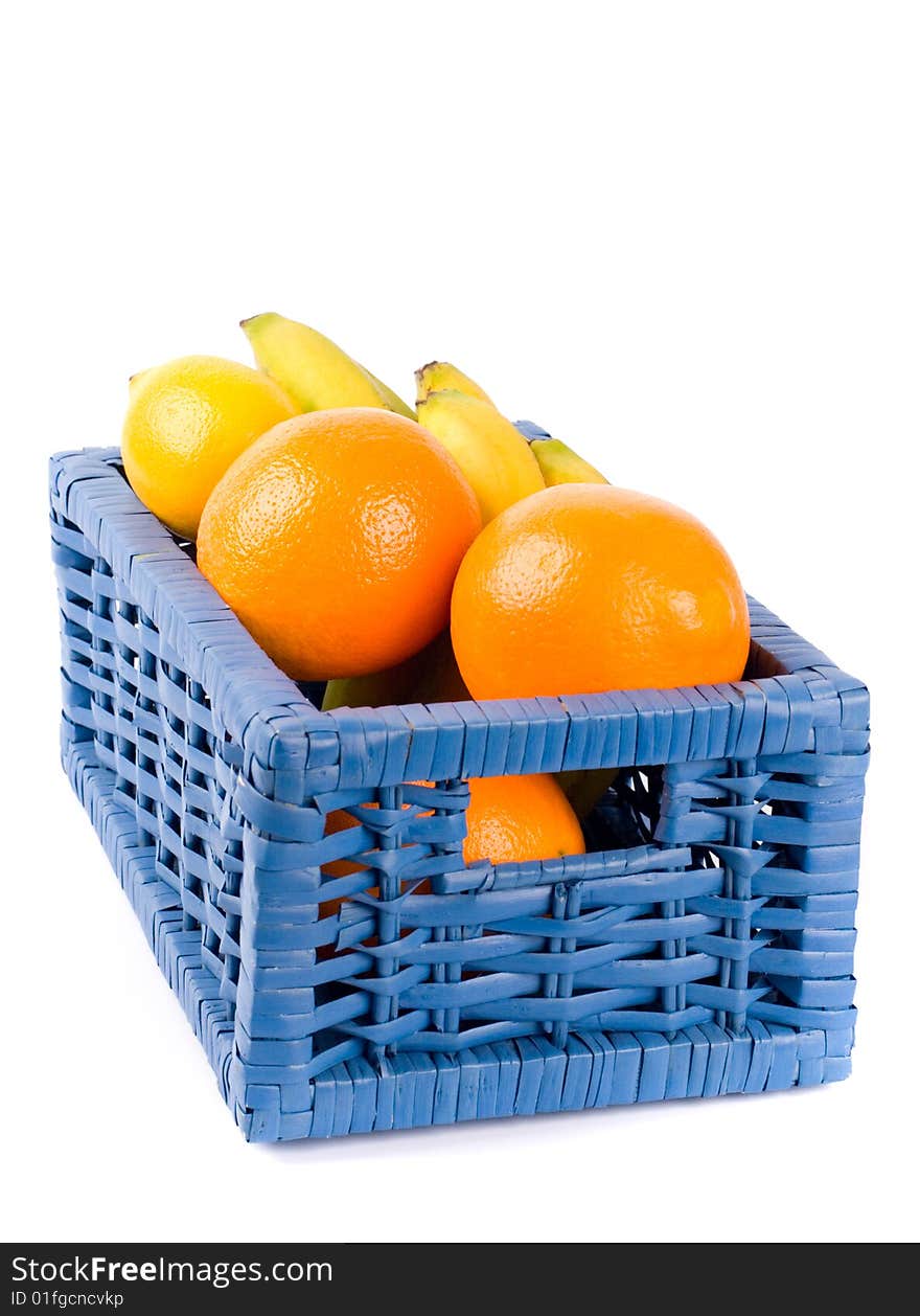 Blue basket with fruits on white background