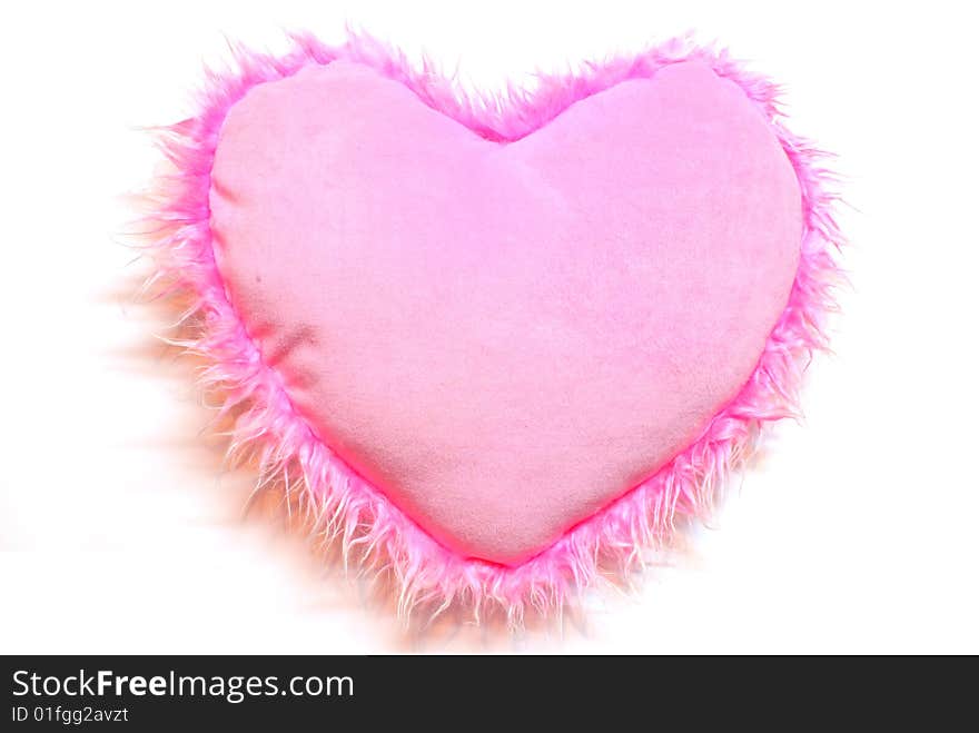 Pink heart a cushion is isolated on white