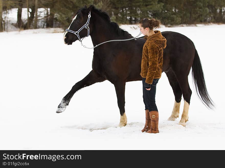 The girl trains a horse. The girl trains a horse