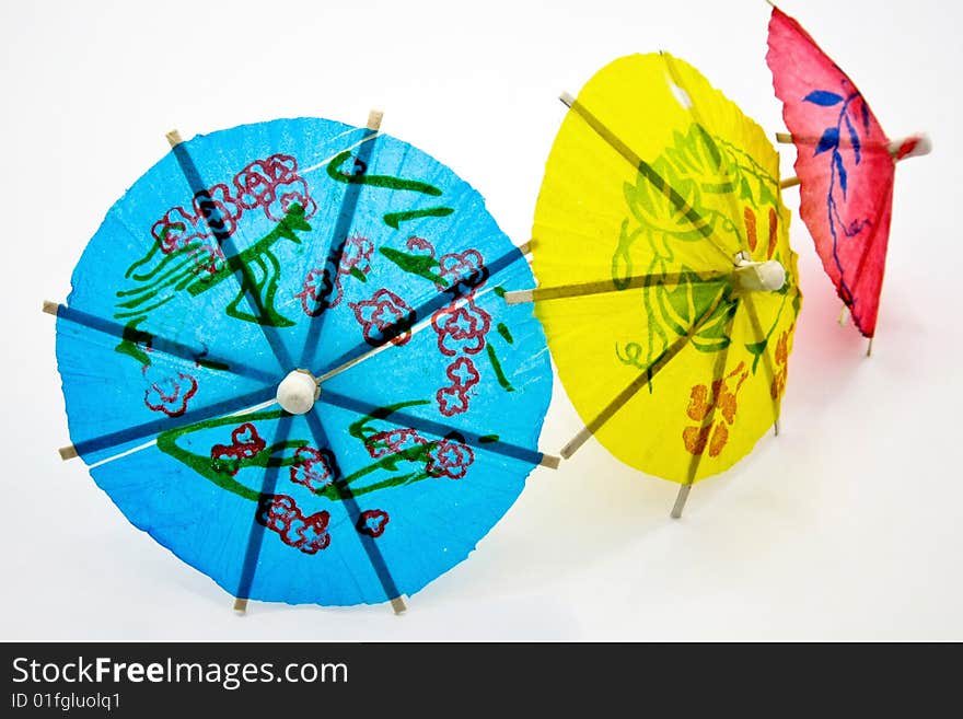 color paper umbrellas on white