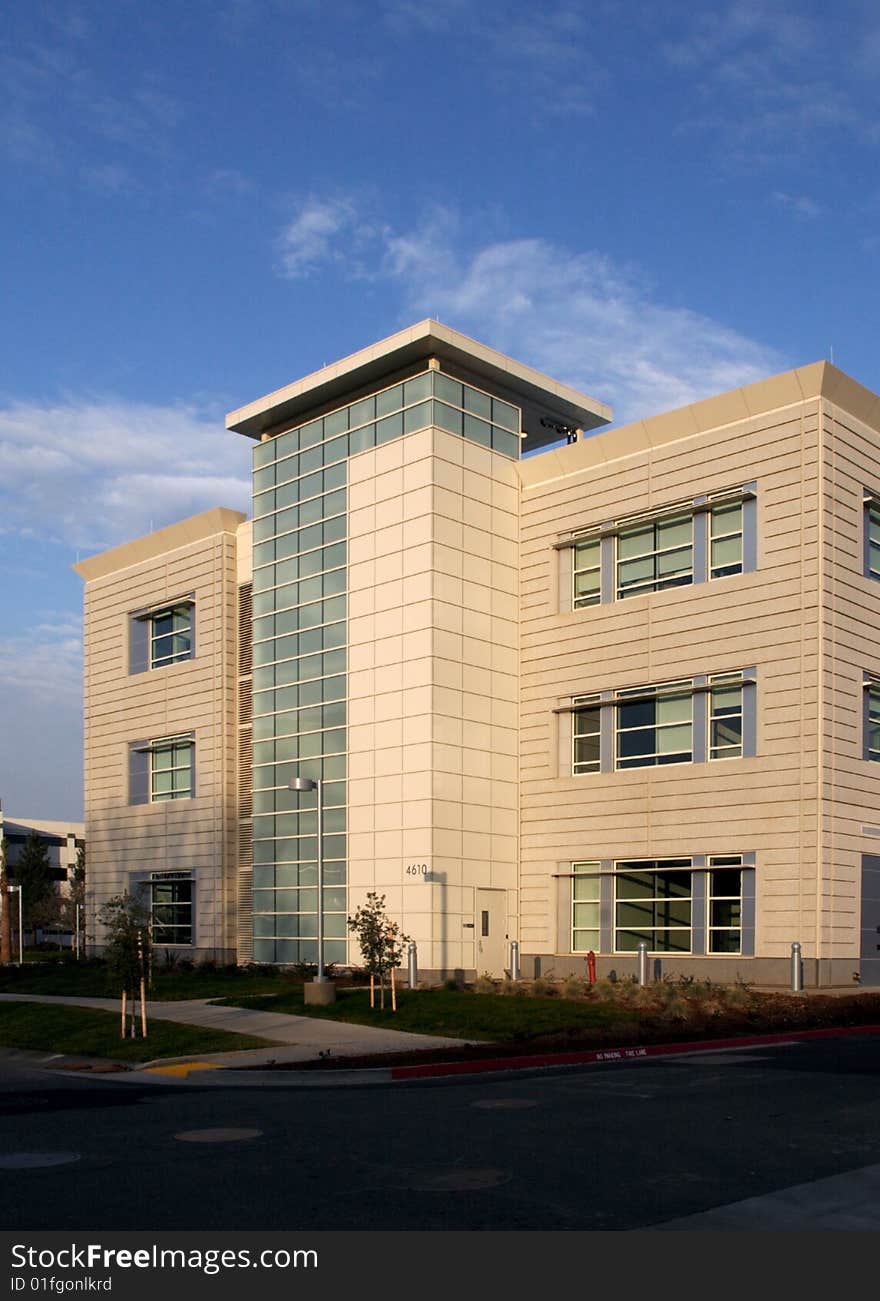 An office building with a empty parking lot