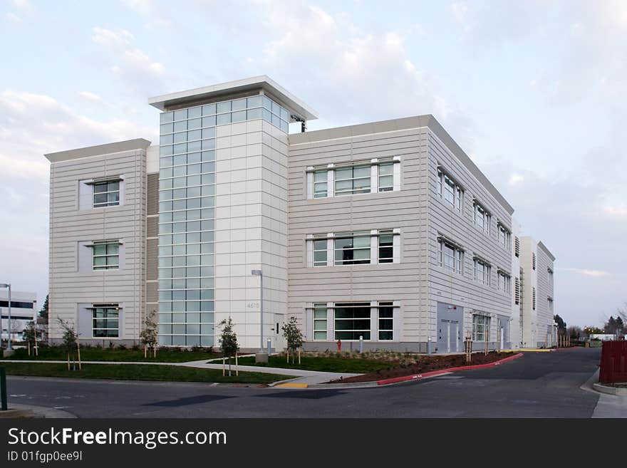 An office building with a empty parking lot