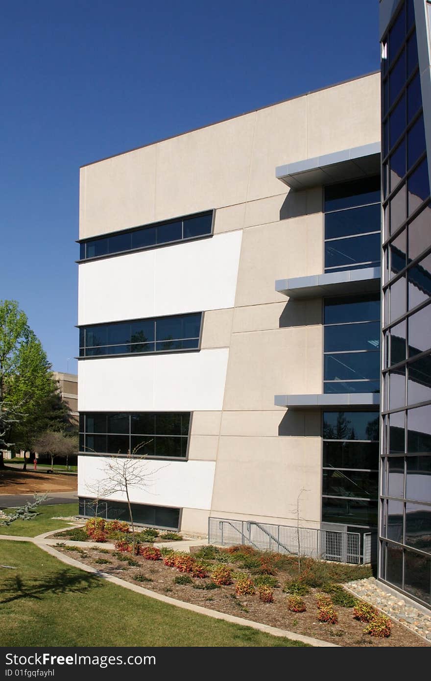 An office building with a empty parking lot