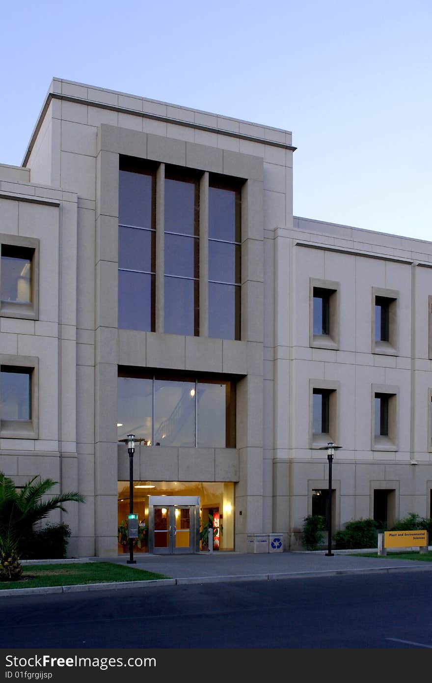 An office building with a empty parking lot