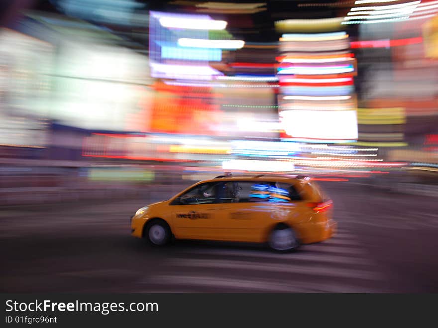 New York Yellow Taxi Speeding Through Times Square