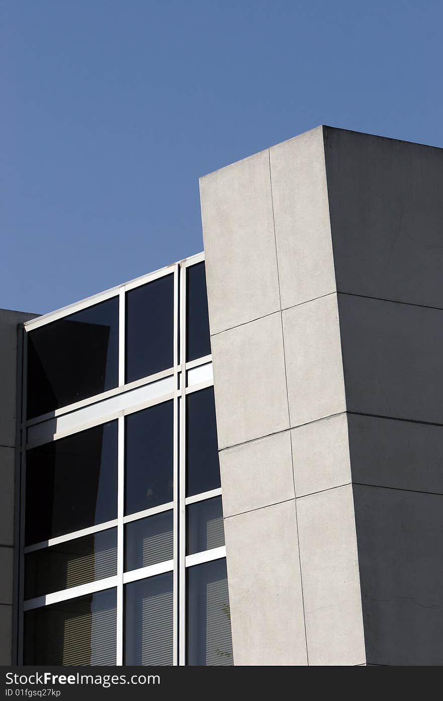 An office building with a empty parking lot