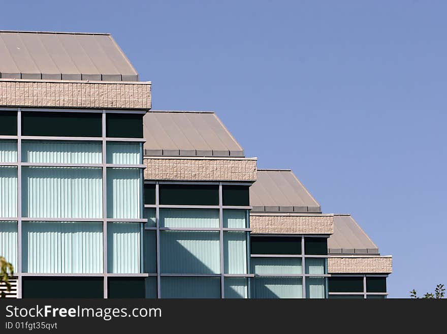 An office building with a empty parking lot