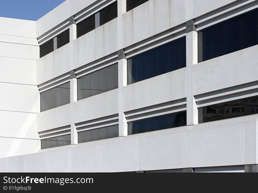 An office building with a empty parking lot