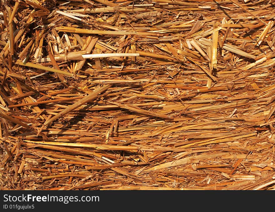 Straw hay bail, lit with wam afternoon sun great for backgrounds or any agricultural designs. Straw hay bail, lit with wam afternoon sun great for backgrounds or any agricultural designs