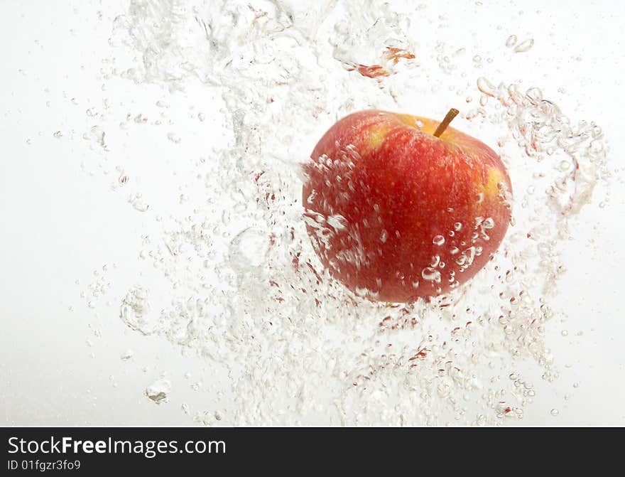 Tasty an apple in water.