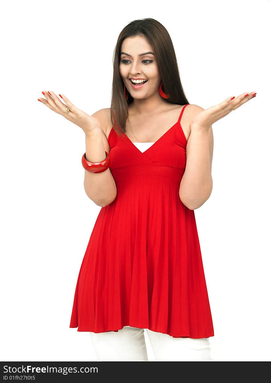 A surprised asian woman of indian origin shot in white background. A surprised asian woman of indian origin shot in white background