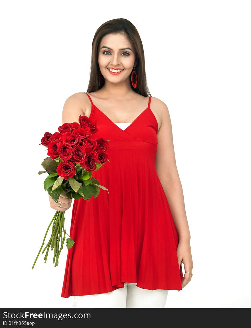 A smiling woman with a bouquet of red roses. A smiling woman with a bouquet of red roses