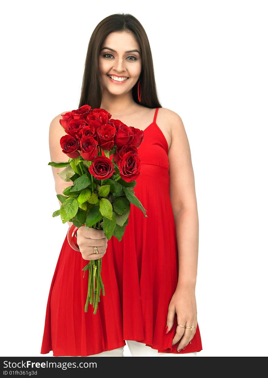 A smiling woman with a bouquet of red roses. A smiling woman with a bouquet of red roses