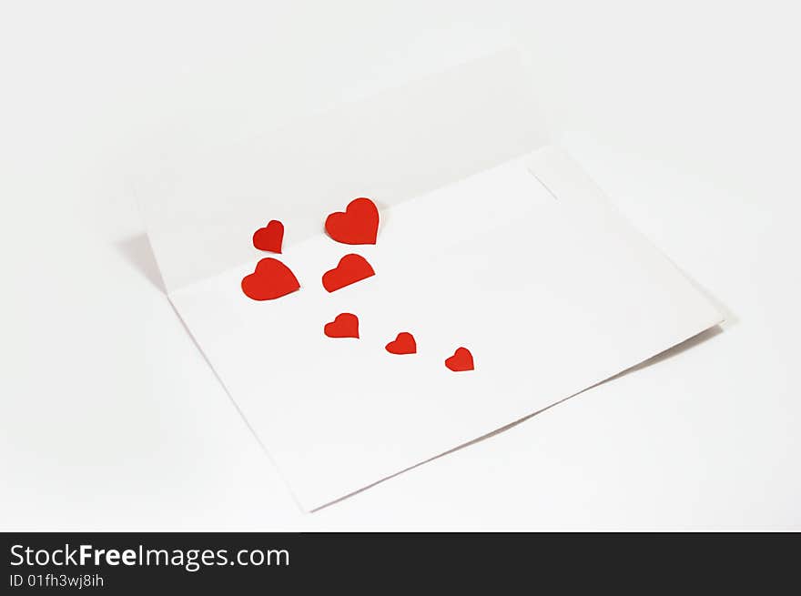 White envelope with hearts over white. White envelope with hearts over white