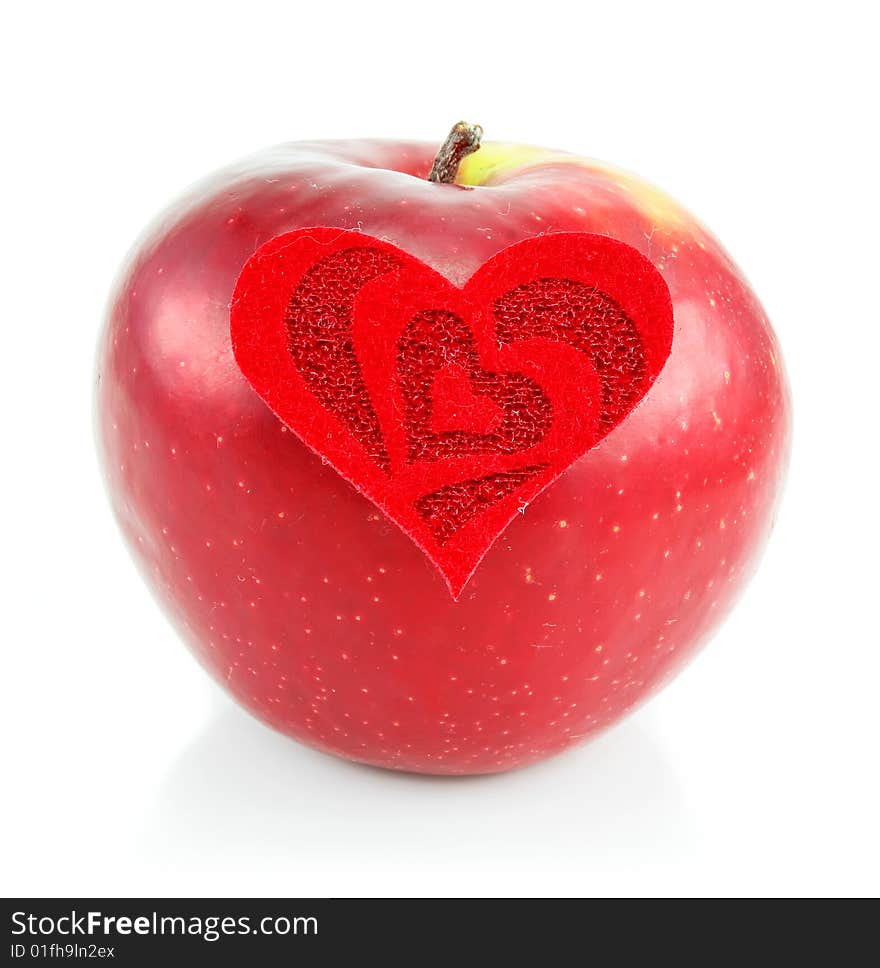 Red apple and red heart made of cloth isolated on a white background