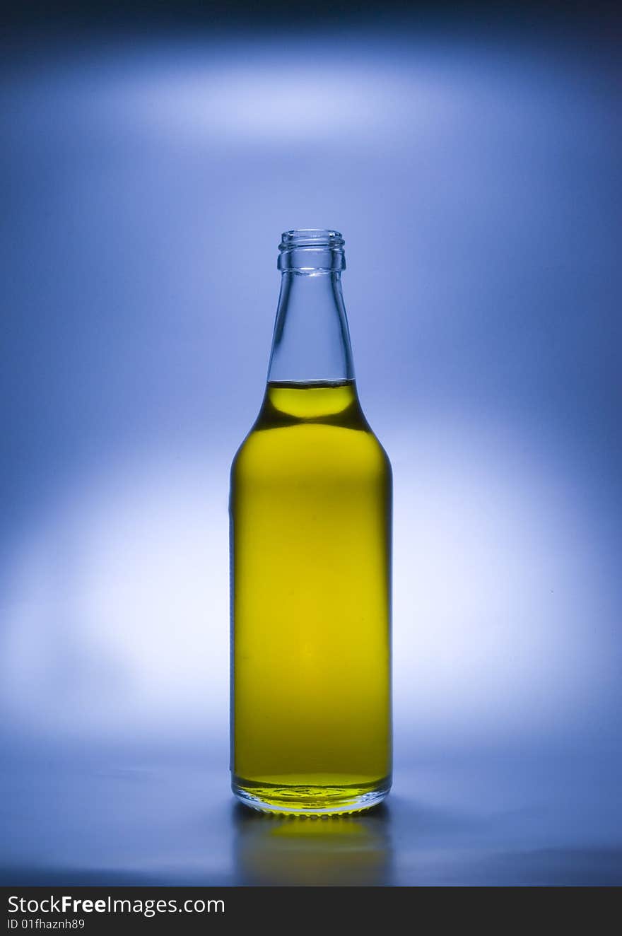 A transparent glass bottle is gap-filling a liquid. A transparent glass bottle is gap-filling a liquid