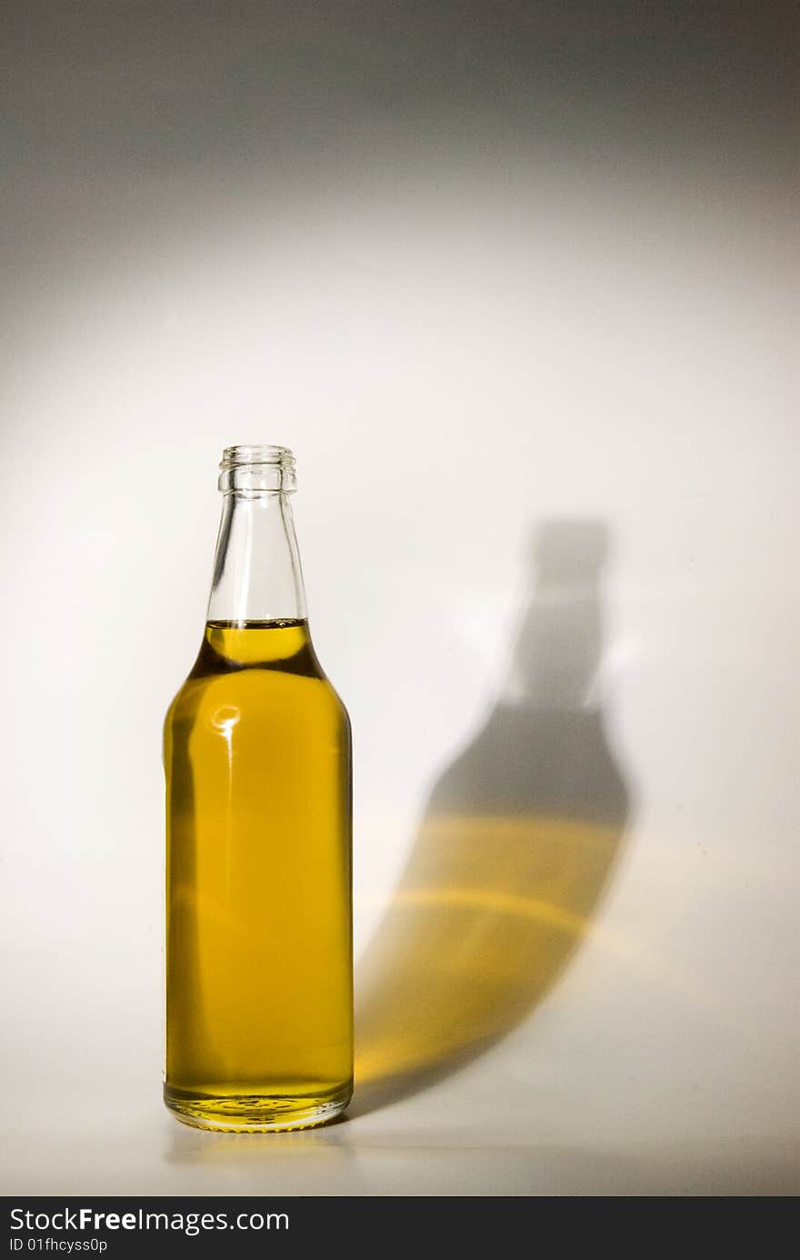 A transparent glass bottle is gap-filling a liquid. A transparent glass bottle is gap-filling a liquid