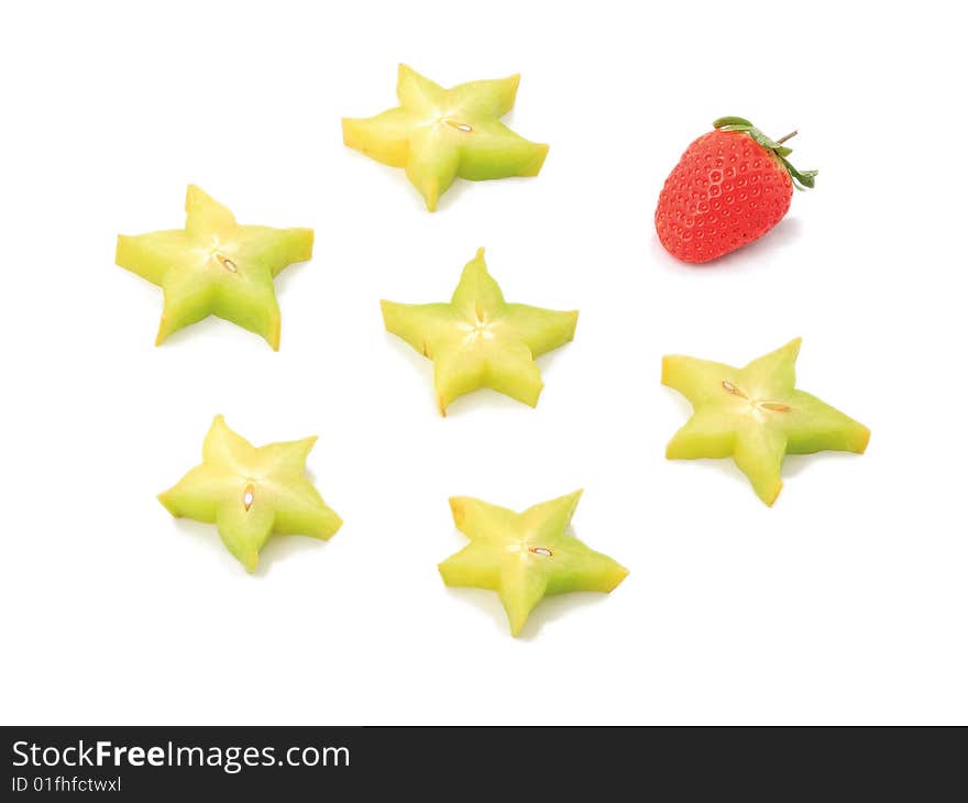 Strawberry near to tropical stars on a white background