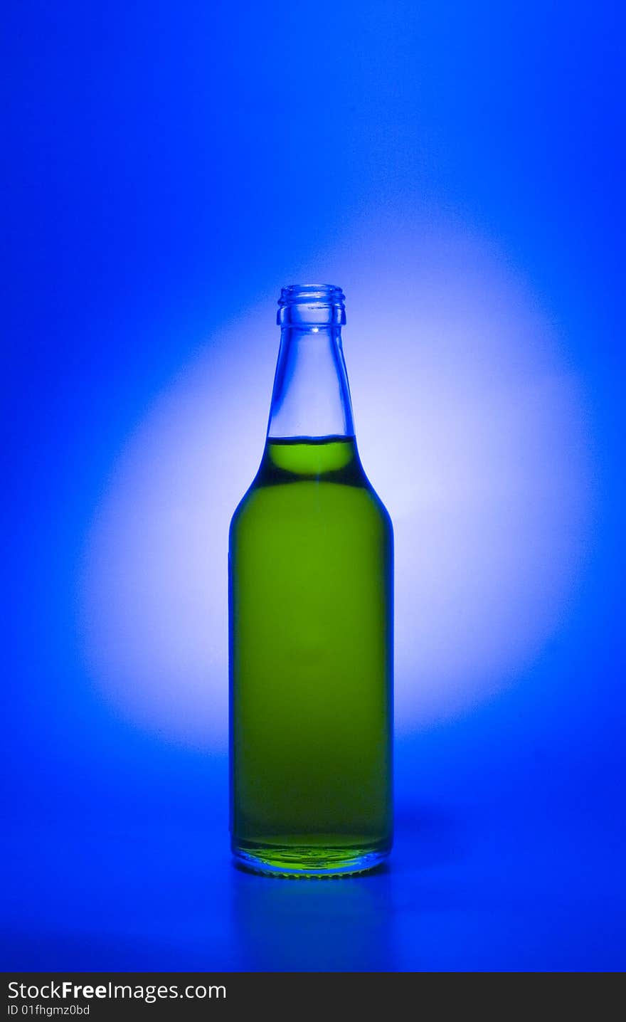 A transparent glass bottle is gap-filling a liquid. A transparent glass bottle is gap-filling a liquid