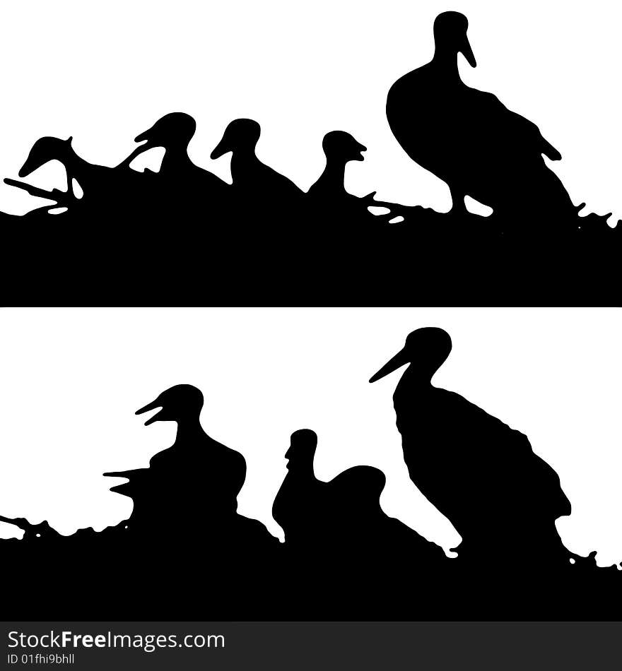 A silhouette of stork with its chicks. A silhouette of stork with its chicks