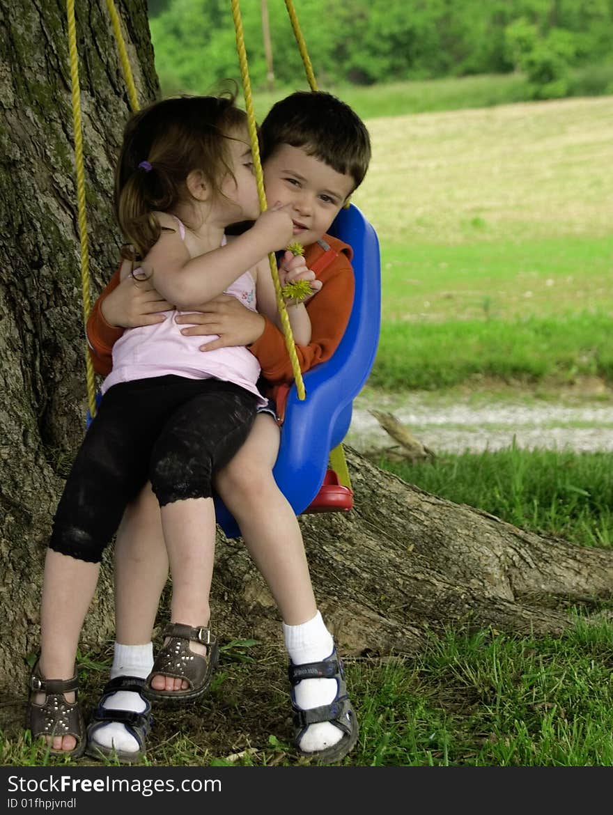 I found them fighting over the swing, but it looks like Alexis is kissing Alex. I found them fighting over the swing, but it looks like Alexis is kissing Alex