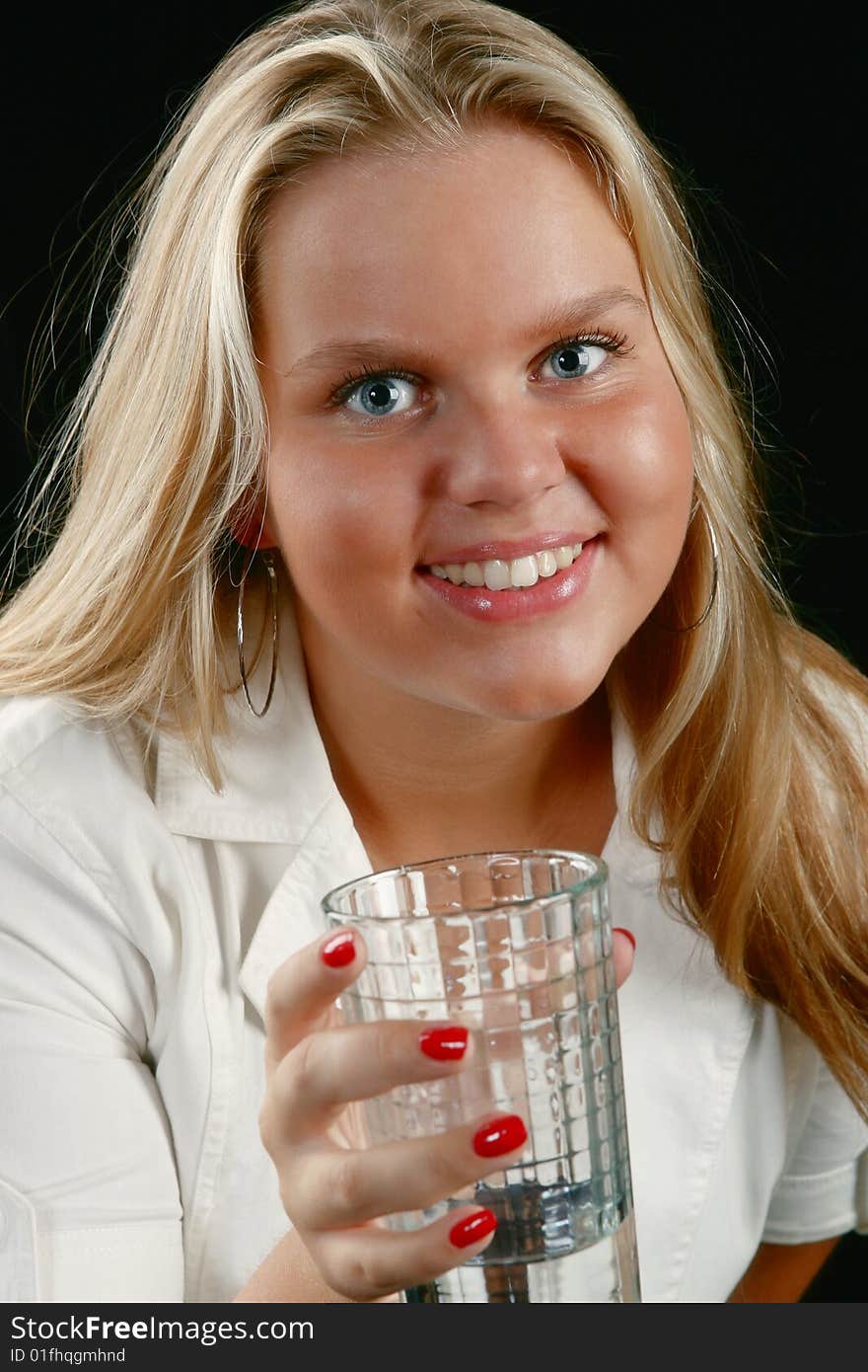 Blond girl drinking water from glass