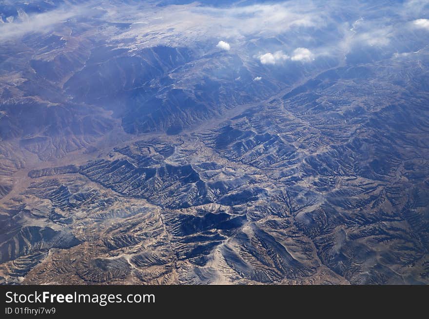 Mountain in clouds,seen from plane. Mountain in clouds,seen from plane