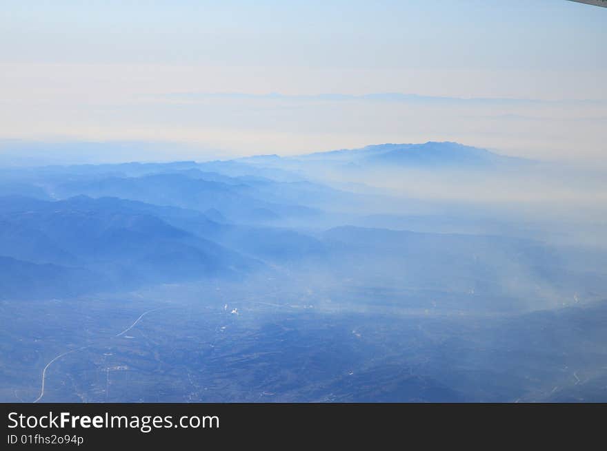 Mountain in clouds,seen from plane. Mountain in clouds,seen from plane