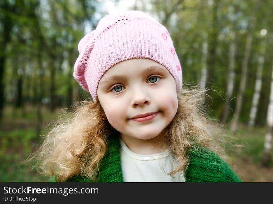 Little girl in spring forest