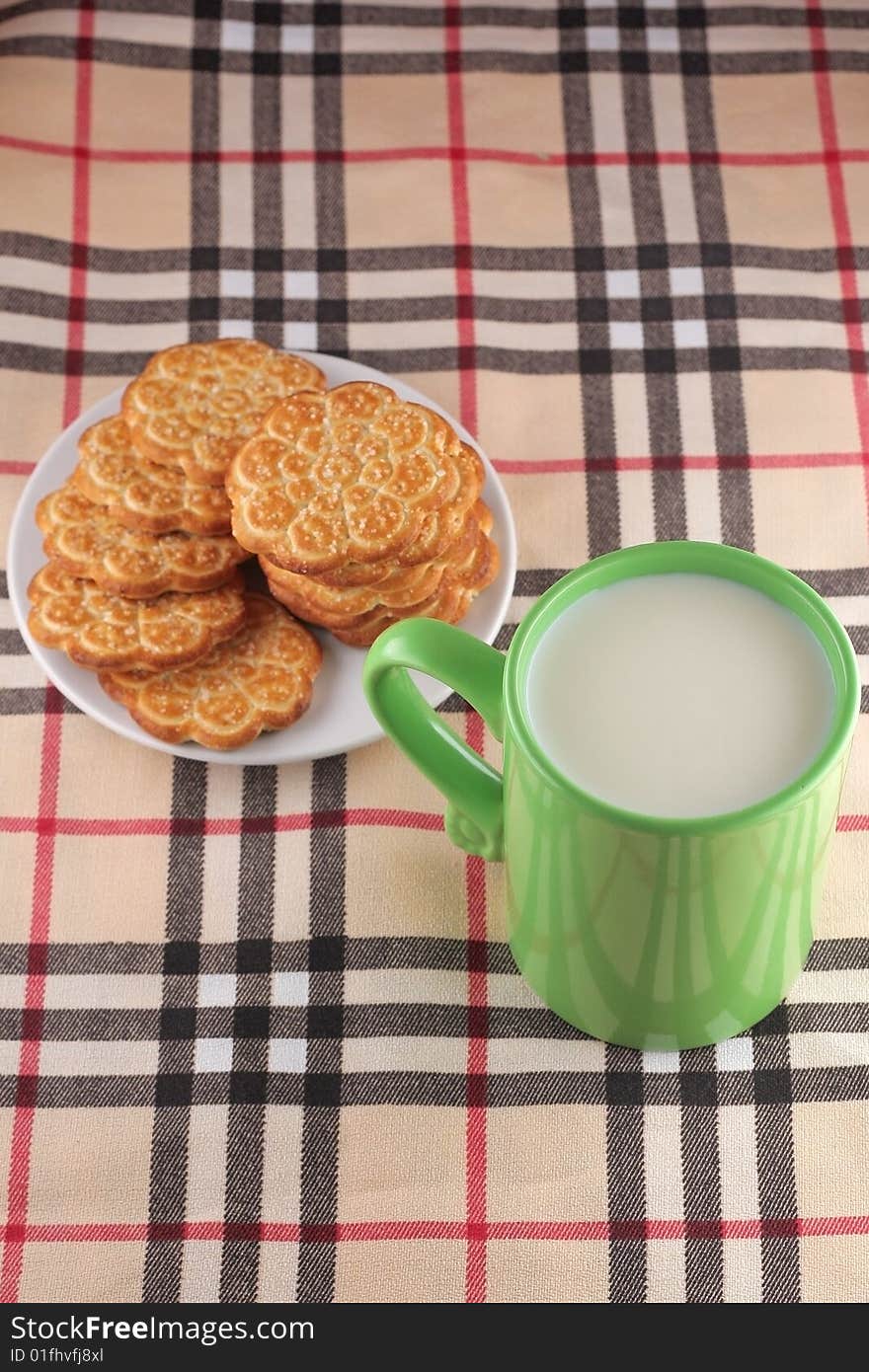 Cookie and cup with milk