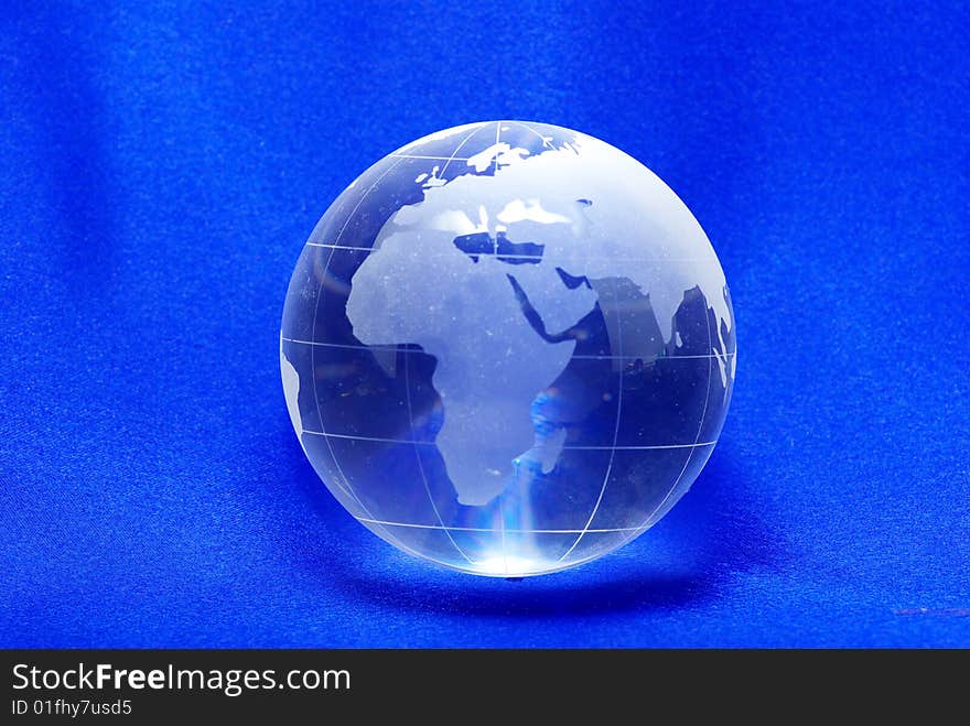 Perfect planet  crystal ball globe isolated on blue. Perfect planet  crystal ball globe isolated on blue