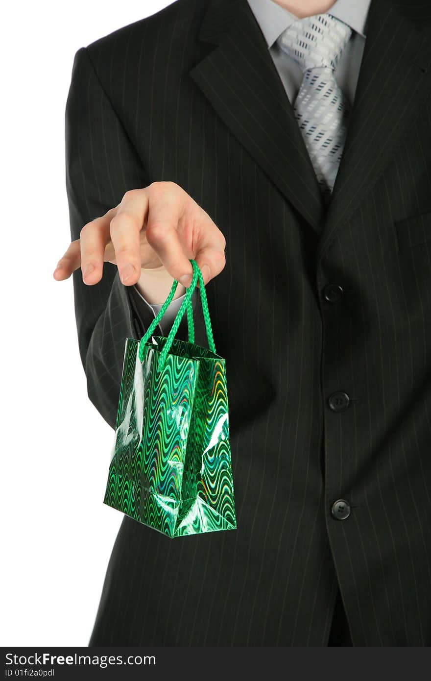 Businessman with gift packet in hand on white