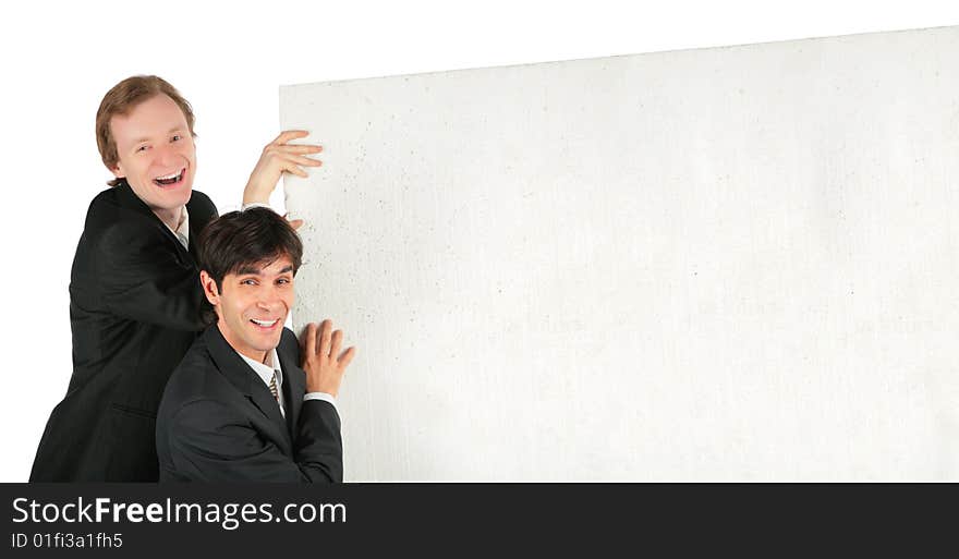 Two businessmen push white plate