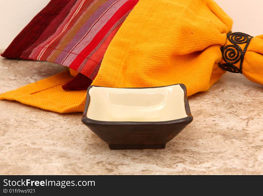 Asian dish over marble with Indian made napkins. Asian dish over marble with Indian made napkins.