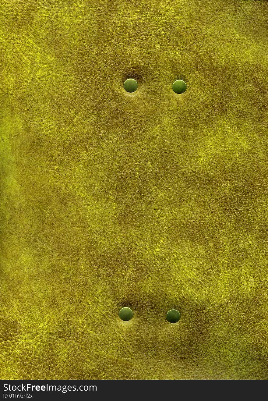 Close-up gold leather texture with rivet to background