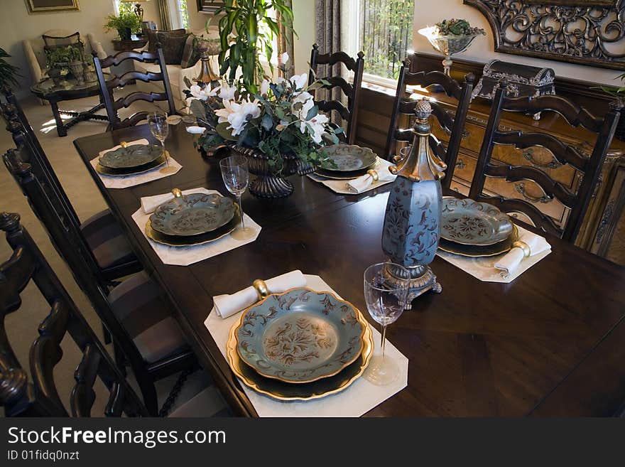 Dining table with luxury tableware and furniture. Dining table with luxury tableware and furniture.