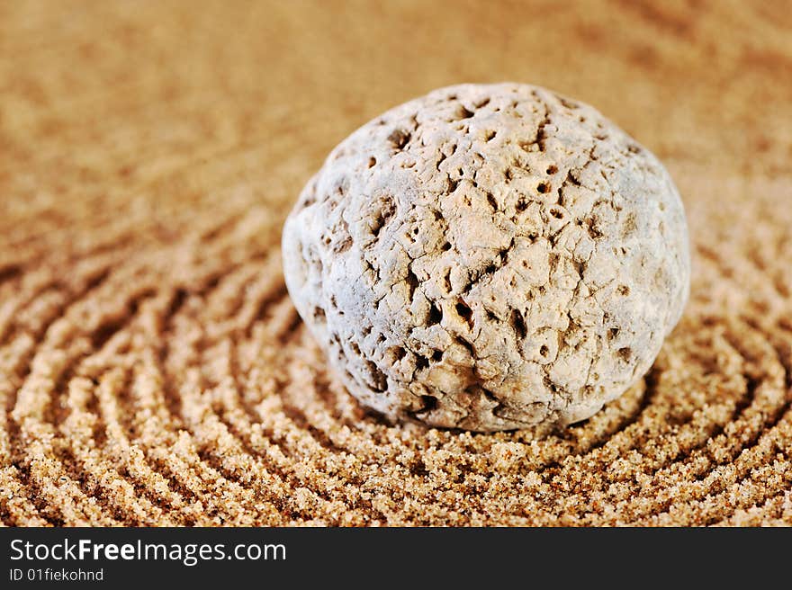 Sea sand and stone in the summer morning on a beach. Sea sand and stone in the summer morning on a beach