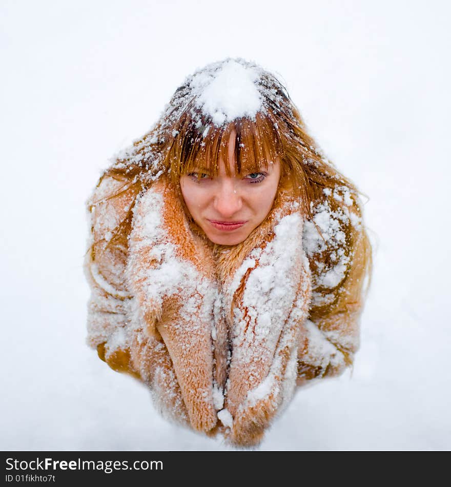 Upset red-heared girl in fur coat - shallow DOF. Upset red-heared girl in fur coat - shallow DOF