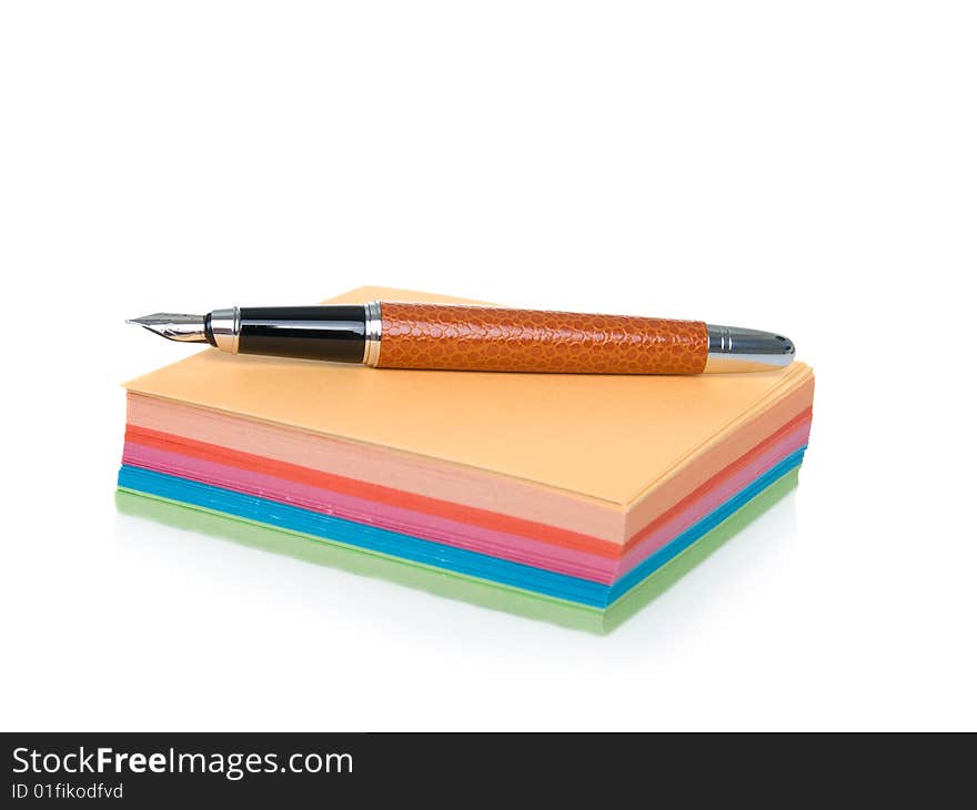 Notes block and pen isolated on a white background.