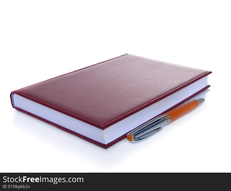 Notebook and pen isolated on a white background