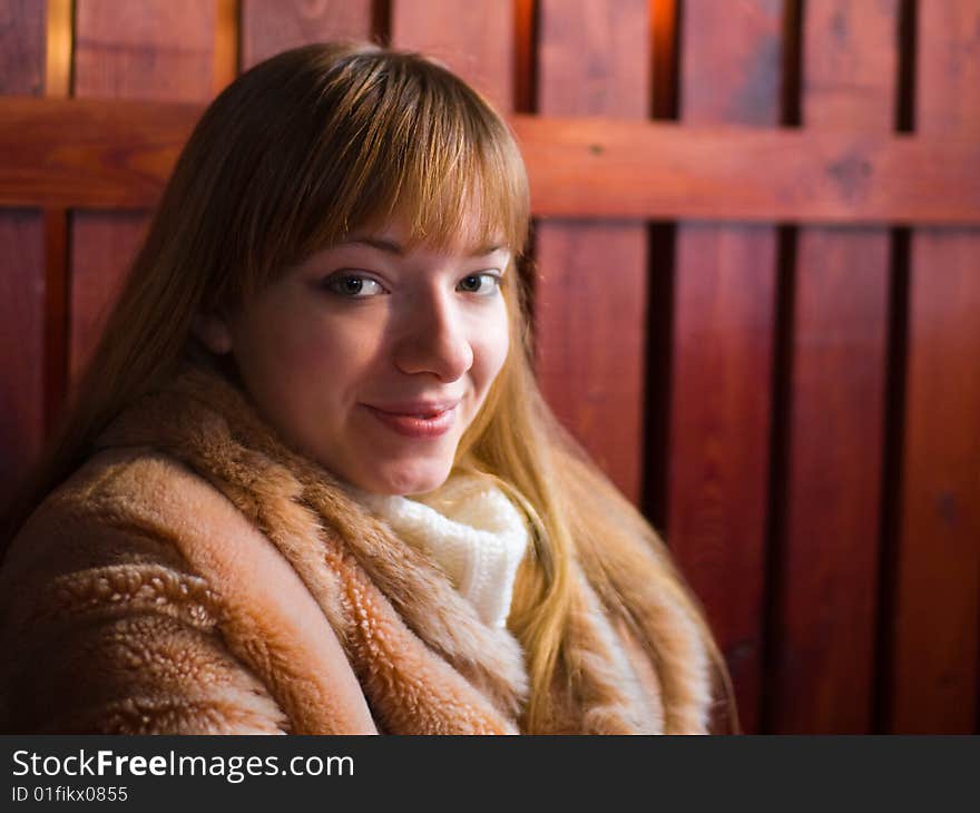 Happy red-haired girl in fur coat - shallow DOF. Happy red-haired girl in fur coat - shallow DOF