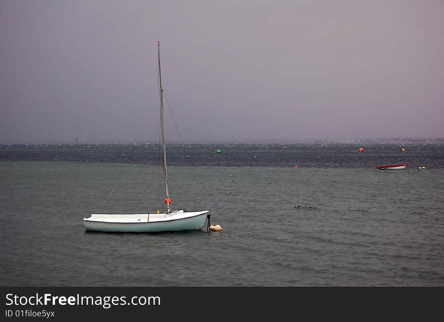 Stormy day in La Manga, Spain. Sailboats risking their integrity. Stormy day in La Manga, Spain. Sailboats risking their integrity.