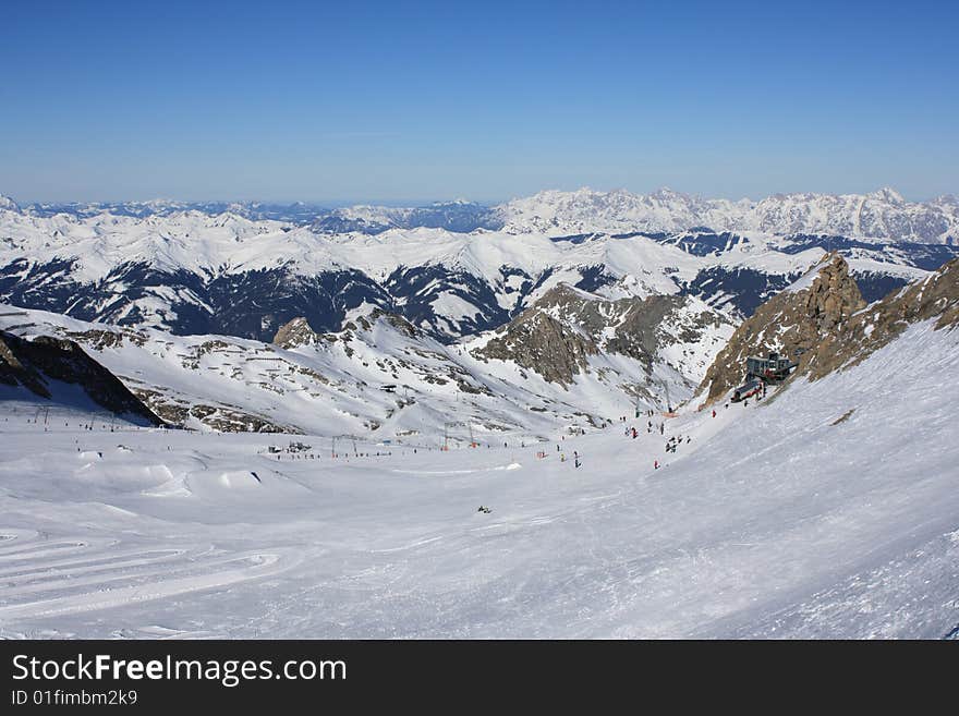 Austria. Mountains. The Alpes.Tops of mountains in a snow and the bright dark blue sky.