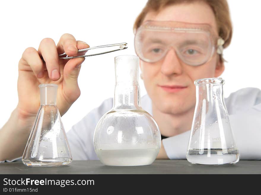 Chemist and three flasks on white